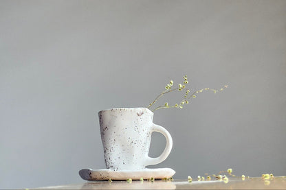 Black white ceramic cup with saucer