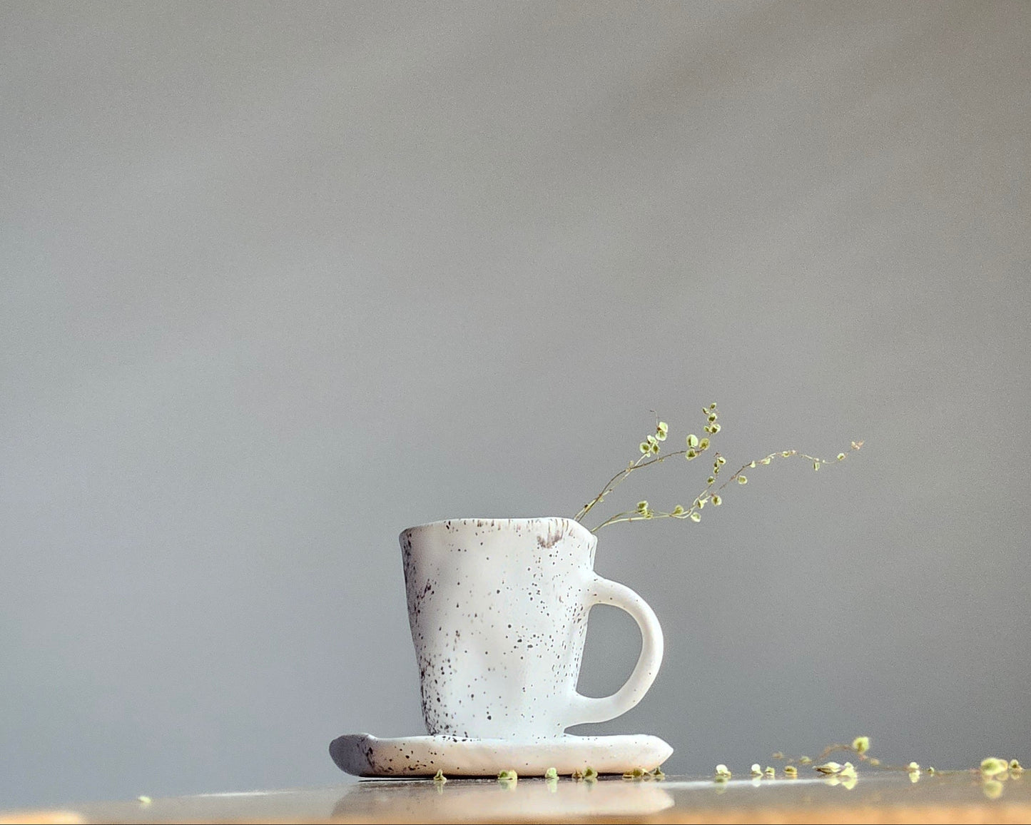 Black white ceramic cup with saucer