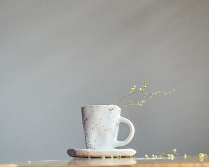 Black white ceramic cup with saucer