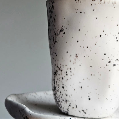 Black white ceramic cup with saucer