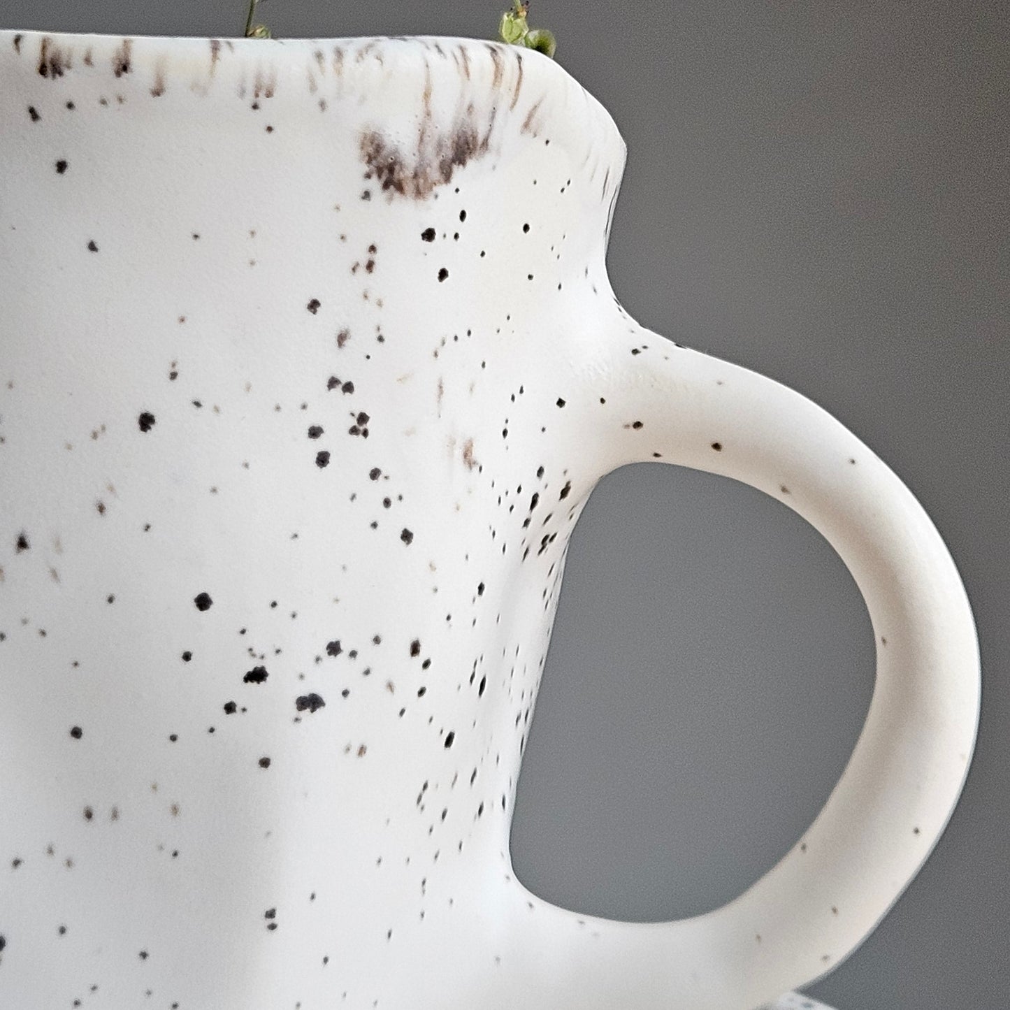 Black white ceramic cup with saucer