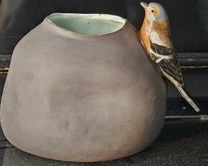 Vase with bird