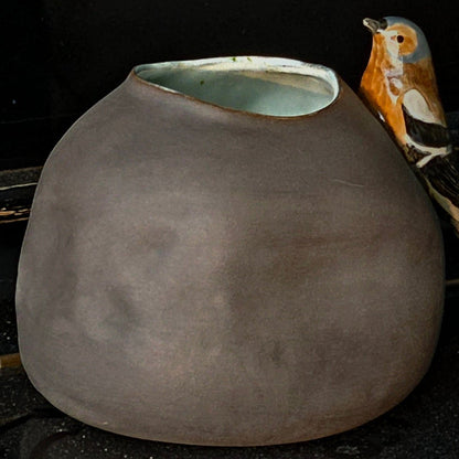 Vase with bird