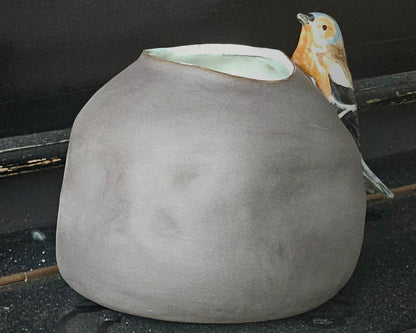 Vase with bird