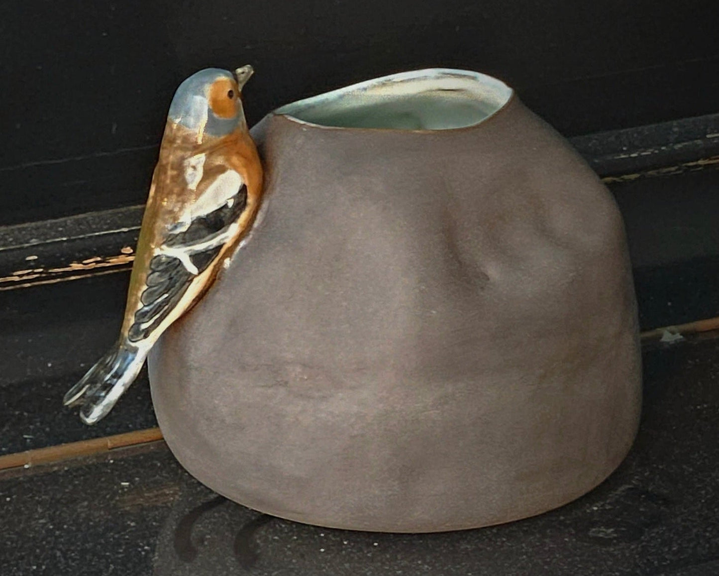 Vase with bird