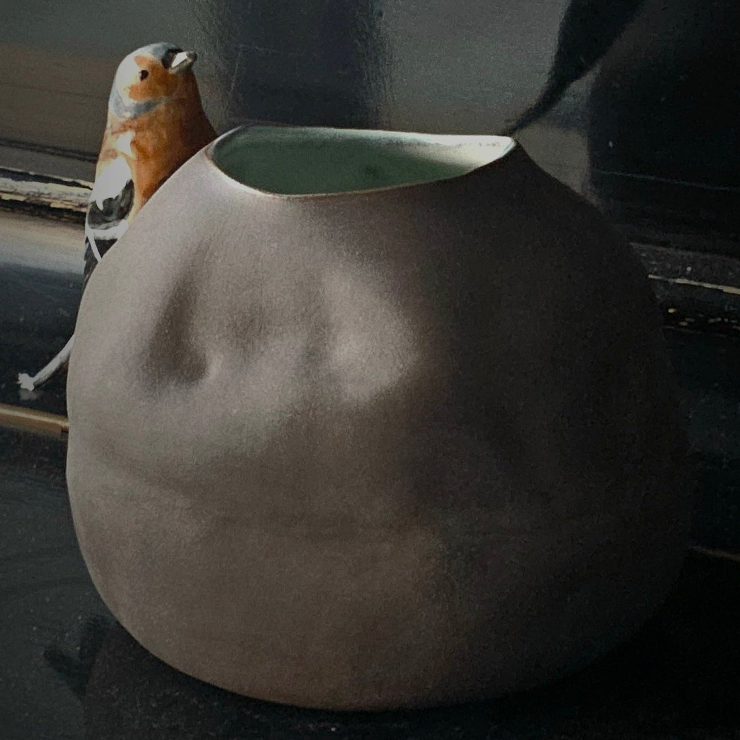 Vase with bird