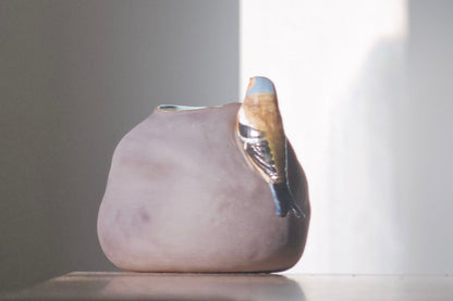 Vase with bird