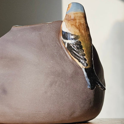 Vase with bird