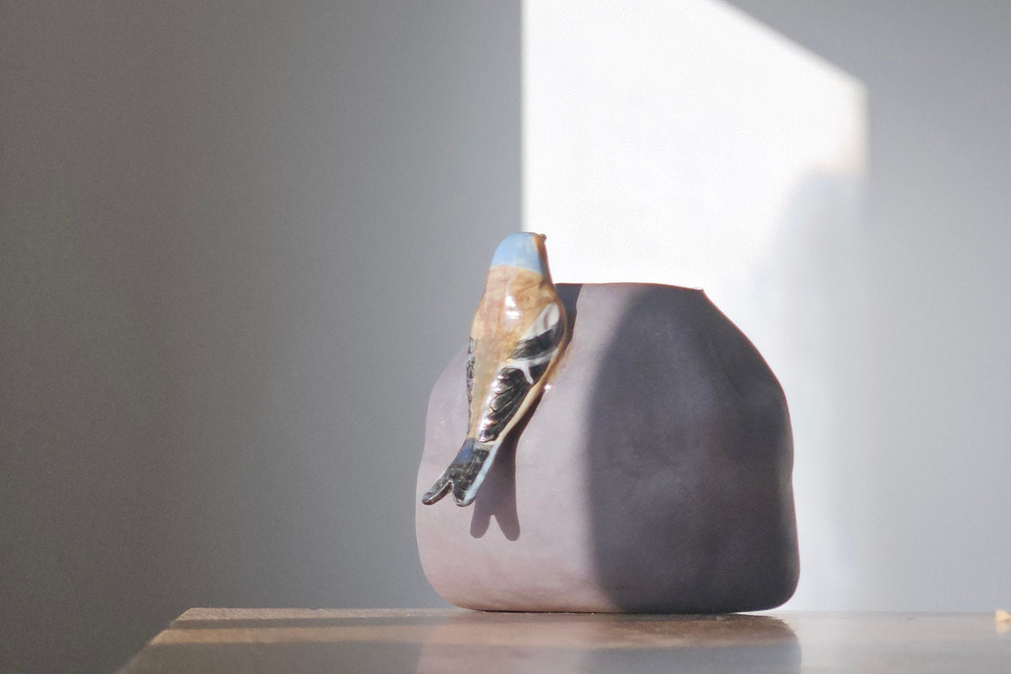 Vase with bird