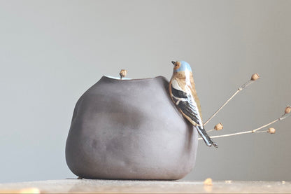 Vase with bird