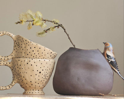 Vase with bird